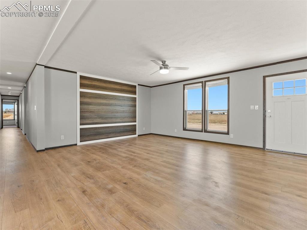 22843 Handle Road Calhan, CO 80808 - Photo 47 of 48 a view of an empty room with a window and wooden floor