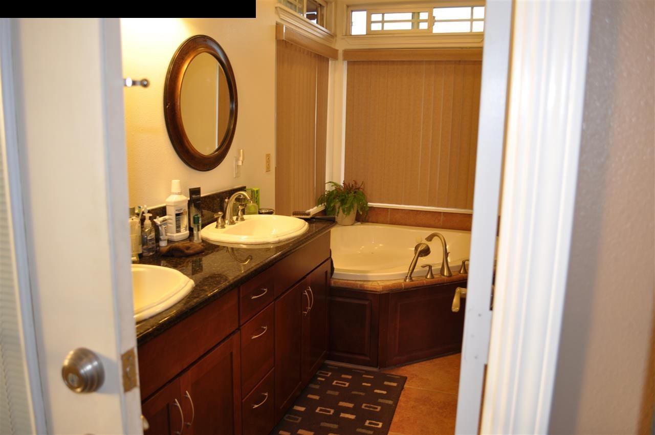 20 Pulehunui Road Kula, HI 96790 - Photo 17 of 30 a bathroom with a granite countertop sink and a mirror