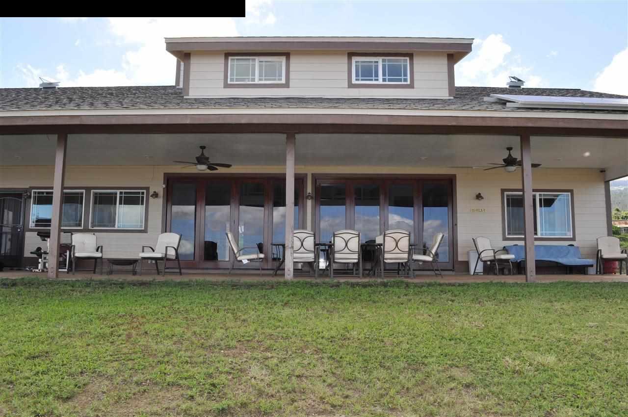 20 Pulehunui Road Kula, HI 96790 - Photo 25 of 30 a view of a house with a backyard and sitting area