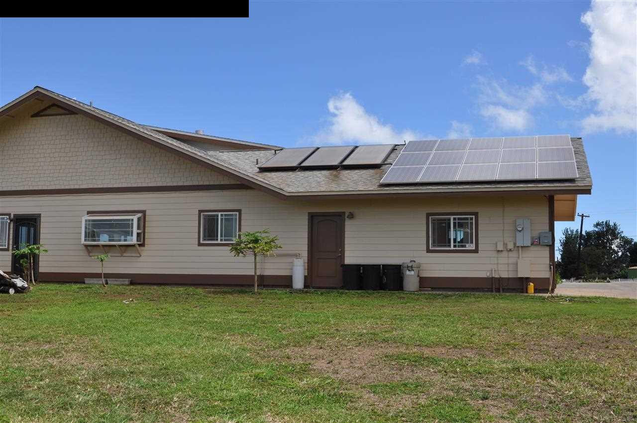 20 Pulehunui Road Kula, HI 96790 - Photo 28 of 30 a backyard of a house with table and chairs