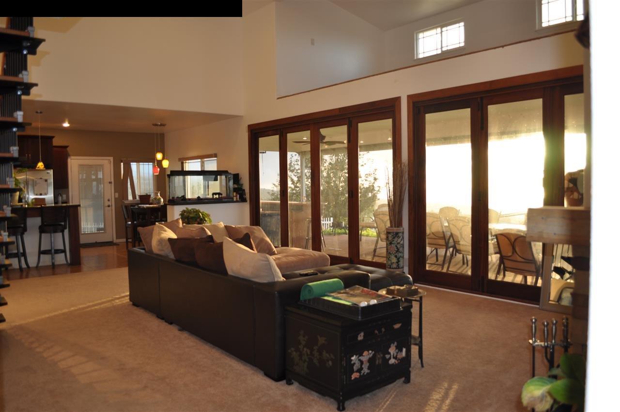 20 Pulehunui Road Kula, HI 96790 - Photo 7 of 30 a living room with furniture and a floor to ceiling window