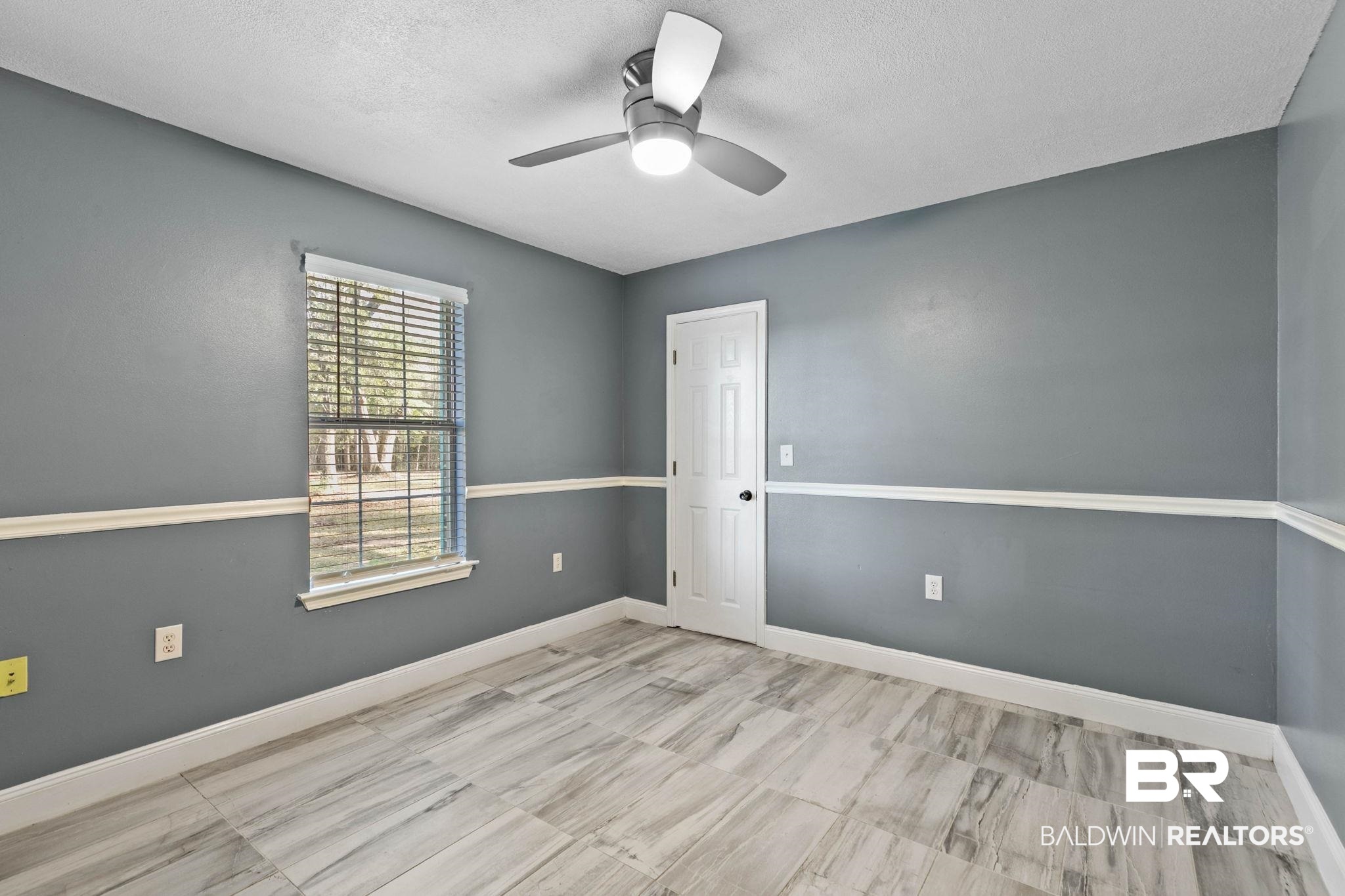 17366 Old Brady Road Bay Minette, AL 36507 - Photo 20 of 43 Empty room featuring ceiling fan and a textured ceiling