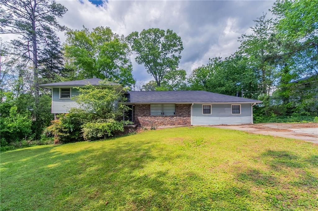 1956 Joseph Court Decatur, GA 30032 - Photo 1 of 1 a front view of a house with yard and green space