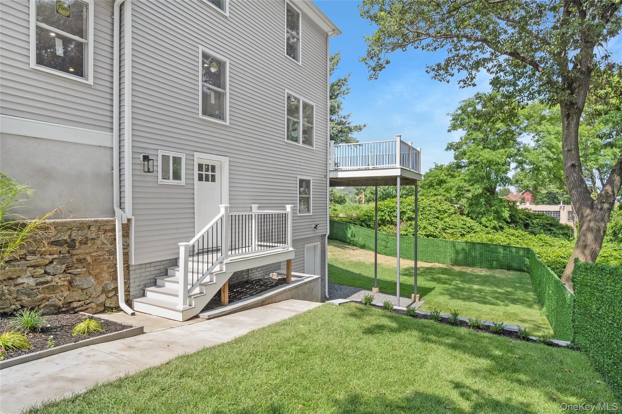 3 Sylvan Place New Rochelle, NY 10801 - Photo 27 of 29 a view of a chair and table in backyard of the house