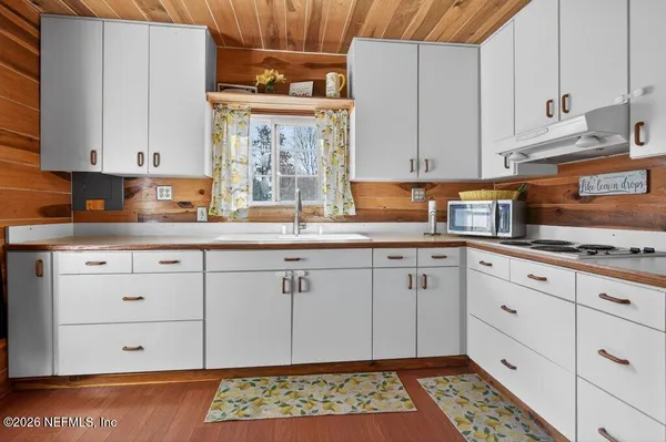 a bedroom with bed and a window