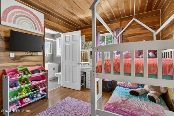 a bedroom with furniture and a window
