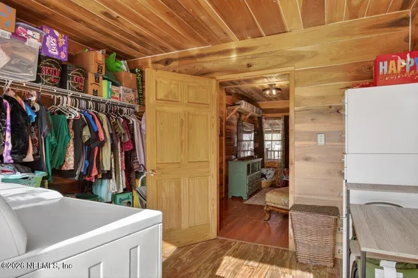 a kitchen with lots of clutter and cabinets