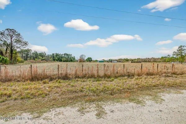 a view of a house with basketball court