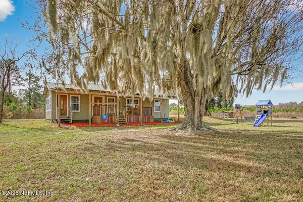 a view of a balcony with wooden floor