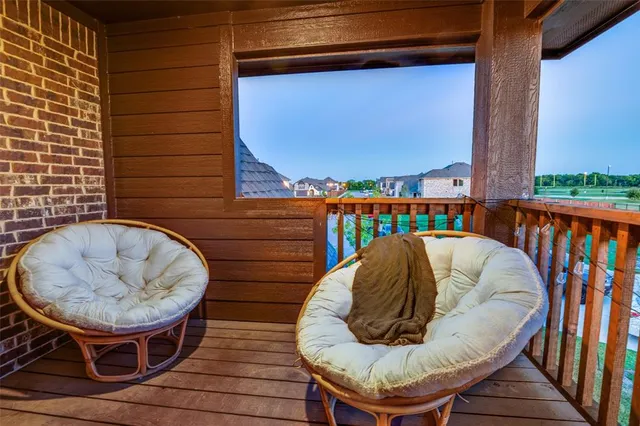 a view of balcony with wooden floor
