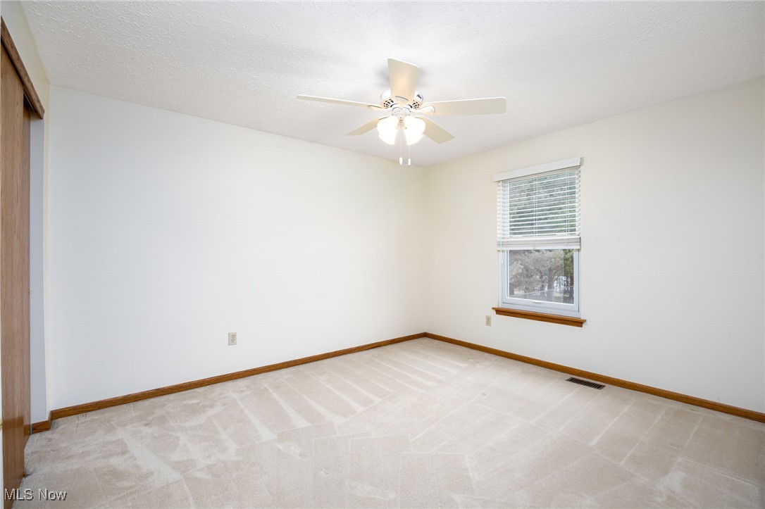 1838 Sandy Lake Road Ravenna, OH 44266 - Photo 35 of 41 Upper-level bedroom with large closet and window with custom blind