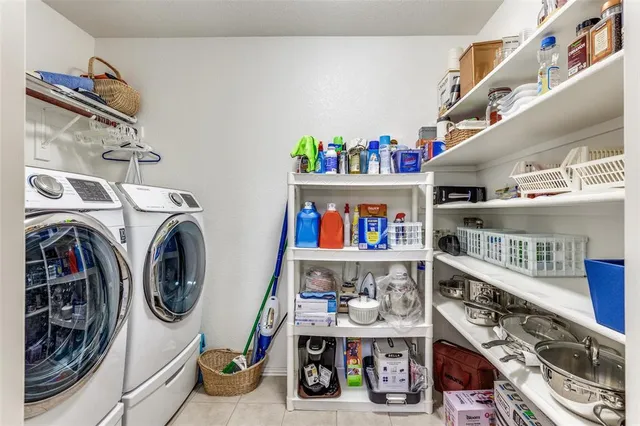 a storage room with washer and dryer