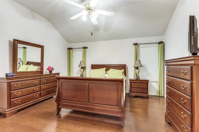 a bedroom with a bed and a dresser