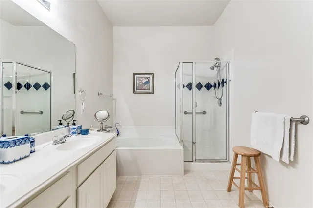 a bathroom with a tub sink and mirror
