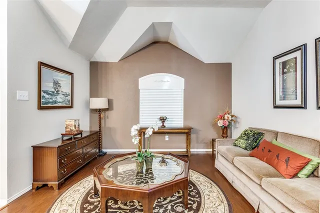 a living room with furniture and a table