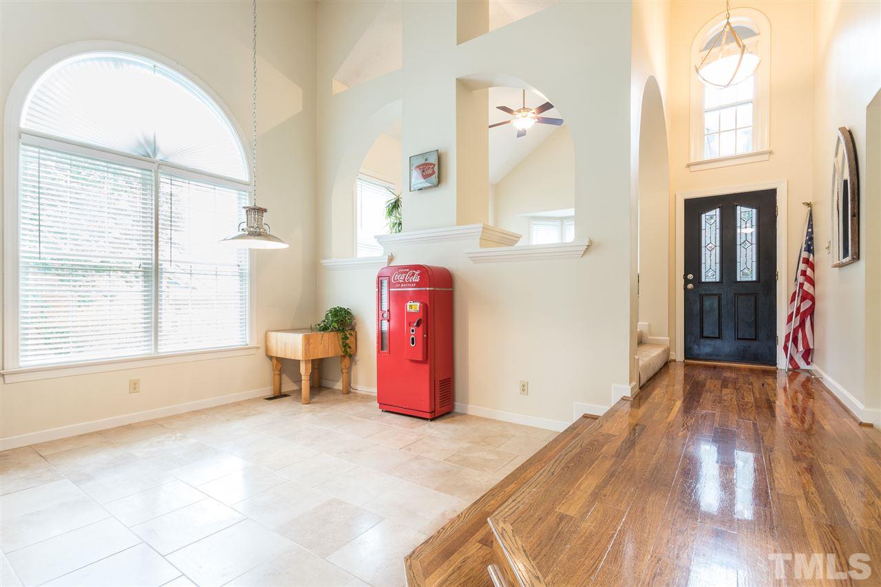 10121 Goodview Court Raleigh, NC 27613 - Photo 12 of 30 a view of a livingroom with wooden floor and a window