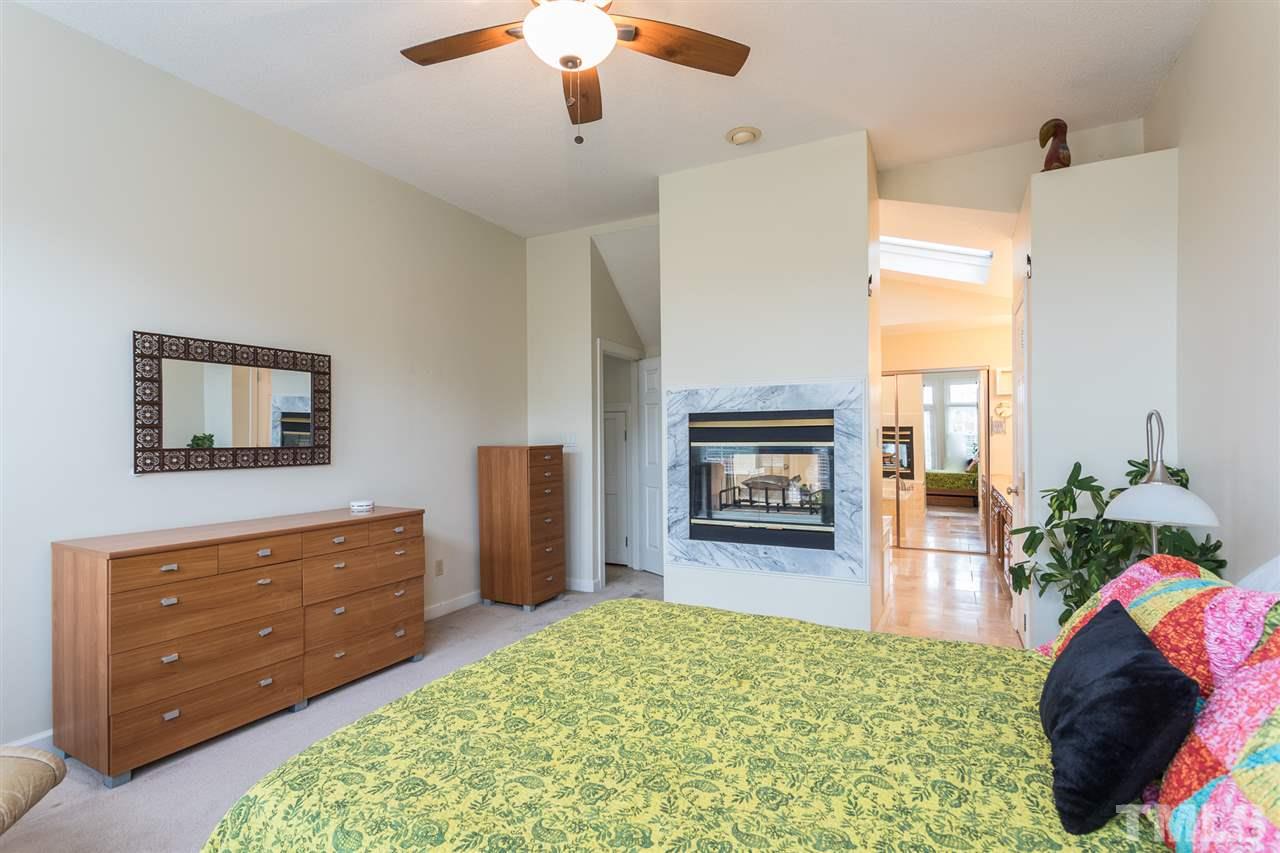 10121 Goodview Court Raleigh, NC 27613 - Photo 22 of 30 a living room with furniture and a fireplace