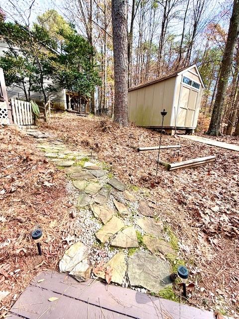 2133 Manawa Lane Fort Mill, SC 29708 - Photo 31 of 35 a backyard of a house with large trees and covered with wooden fence