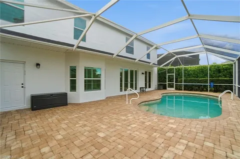 a view of a swimming pool with a porch