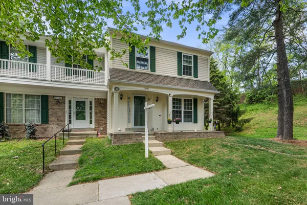 front view of a house that has a yard