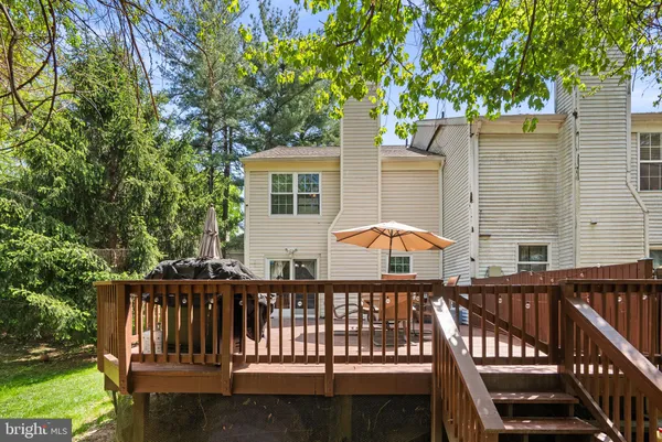a view of a deck with two chair and a table