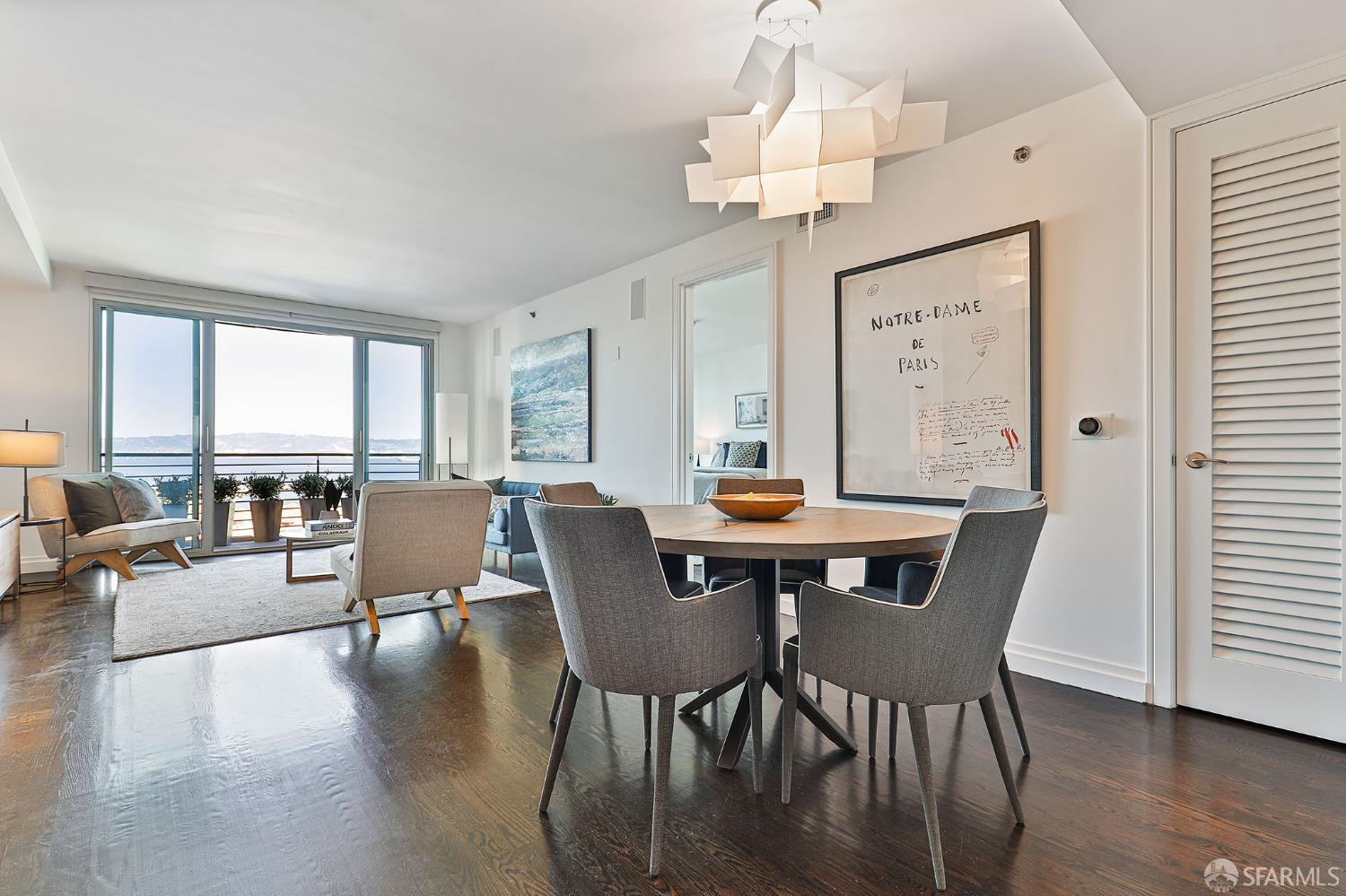 229 Brannan Street, Unit 12C San Francisco, CA 94107 - Photo 12 of 57 a view of a dining room with furniture window and wooden floor