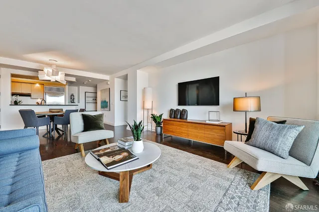 a dining room with furniture and wooden floor