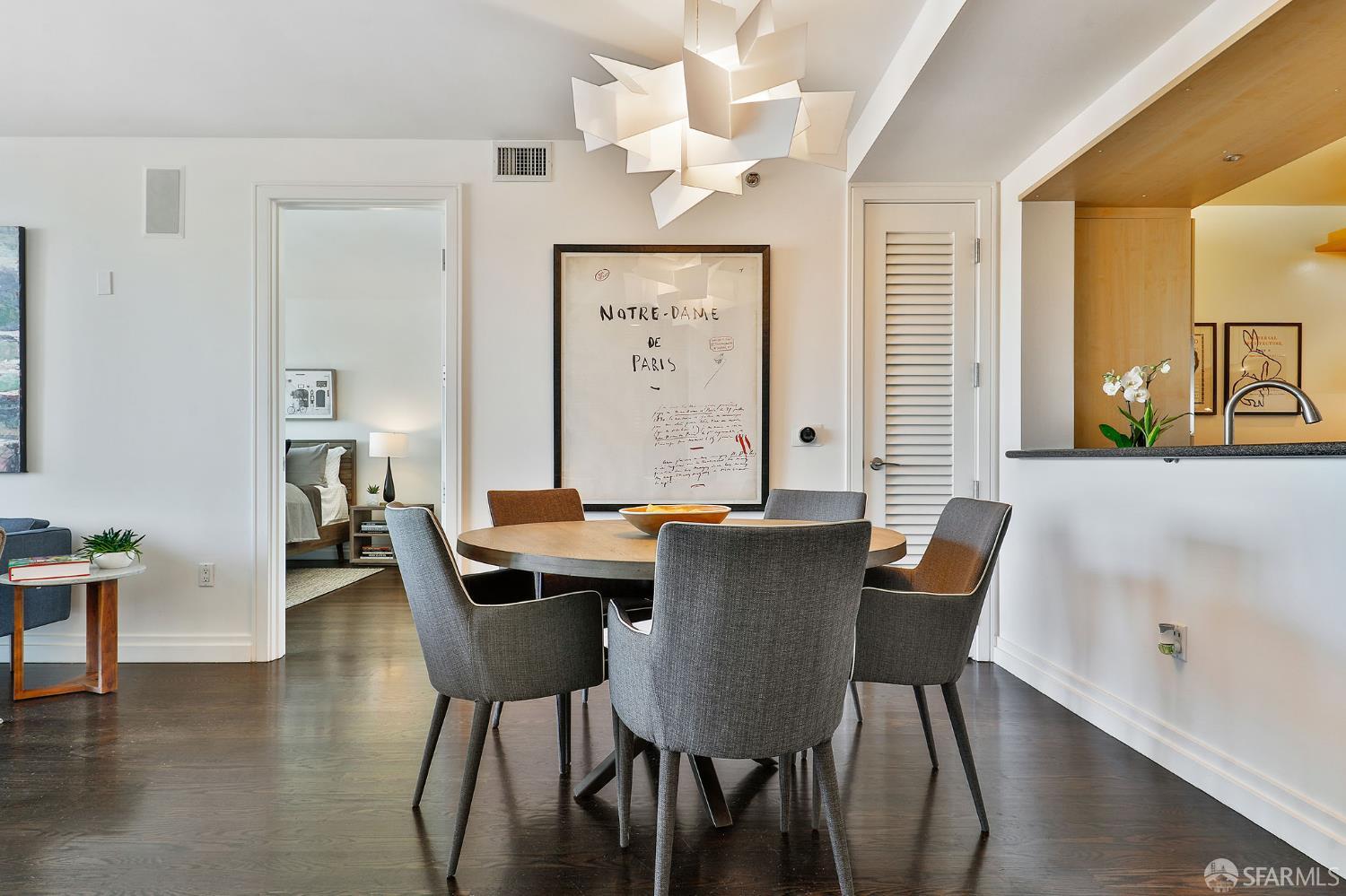 229 Brannan Street, Unit 12C San Francisco, CA 94107 - Photo 15 of 57 a view of a dining room with furniture window and wooden floor