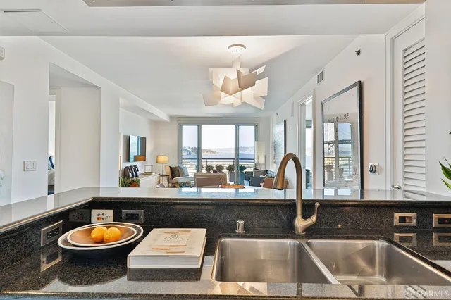 a kitchen with a stove top oven and sink