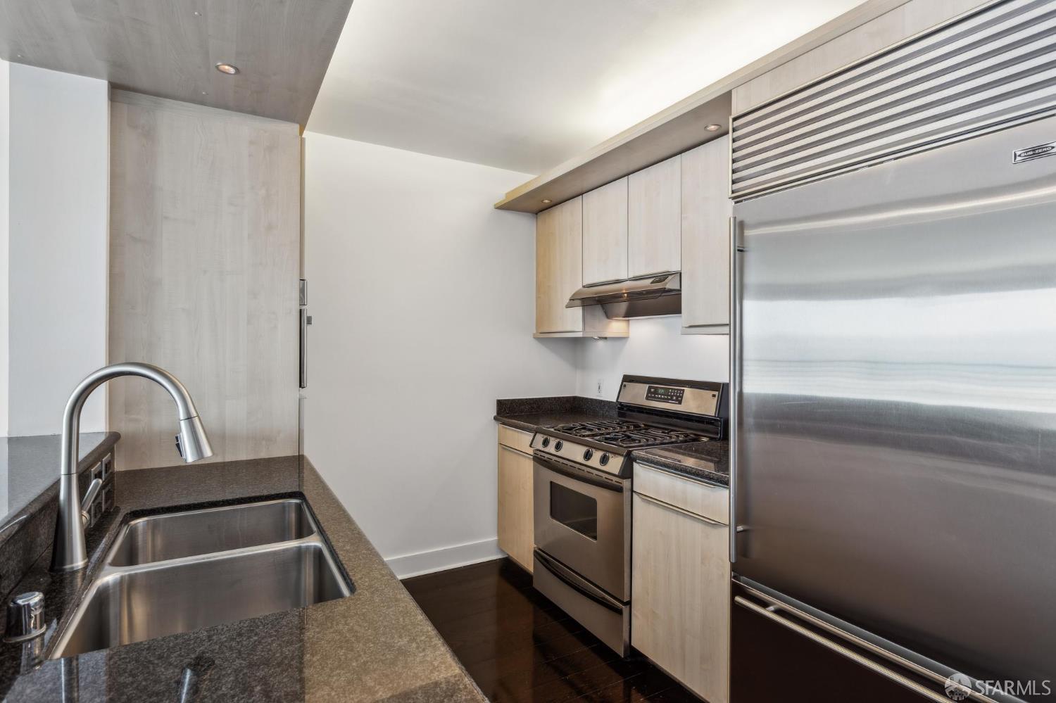 229 Brannan Street, Unit 12C San Francisco, CA 94107 - Photo 18 of 57 a kitchen with a stove top oven and sink