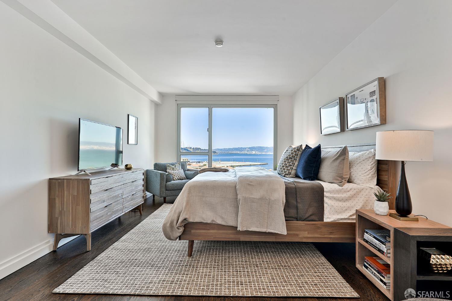 229 Brannan Street, Unit 12C San Francisco, CA 94107 - Photo 21 of 57 a room with a bed and a couch