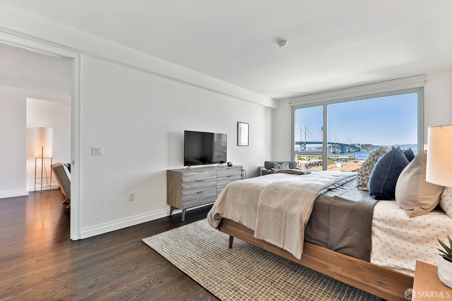 229 Brannan Street, Unit 12C San Francisco, CA 94107 - Photo 22 of 57 a bedroom with a bed and wooden floor