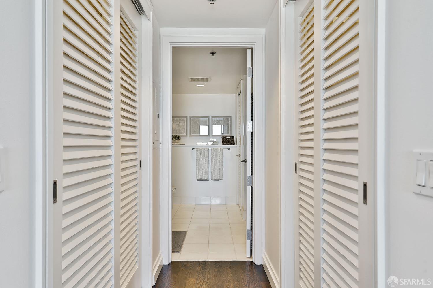 229 Brannan Street, Unit 12C San Francisco, CA 94107 - Photo 24 of 57 hallway with wooden floor and a bathroom