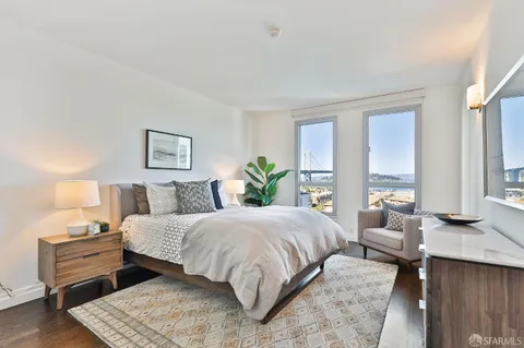 a bedroom with a large bed and a couch