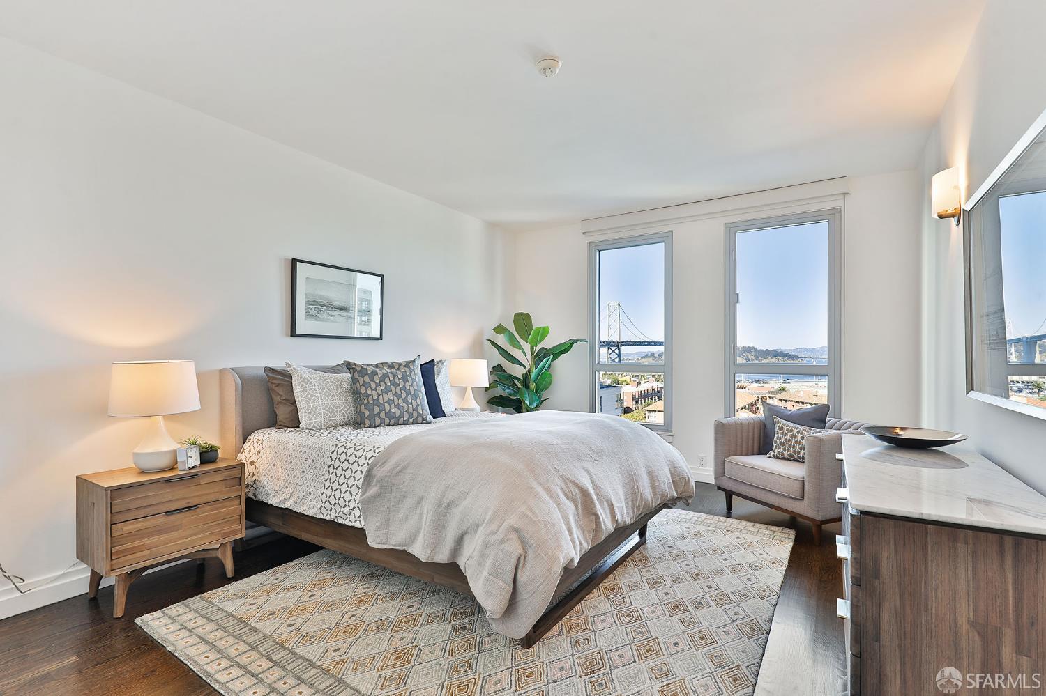 229 Brannan Street, Unit 12C San Francisco, CA 94107 - Photo 30 of 57 a bedroom with a bed and wooden floor