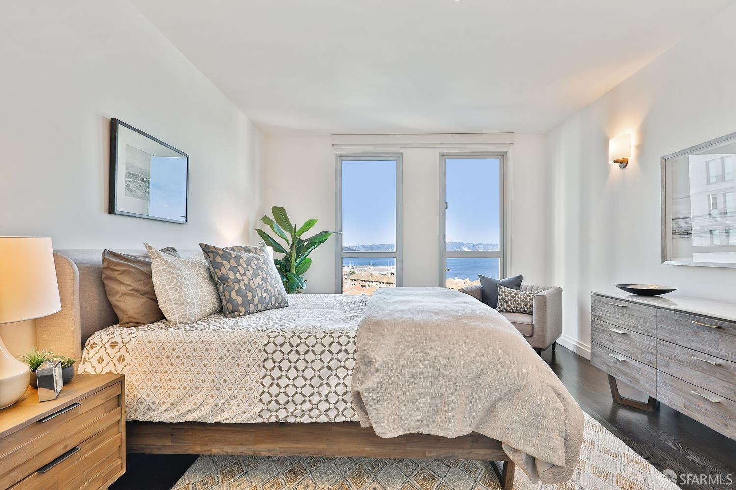 229 Brannan Street, Unit 12C San Francisco, CA 94107 - Photo 31 of 57 a bedroom with a large bed and a couch