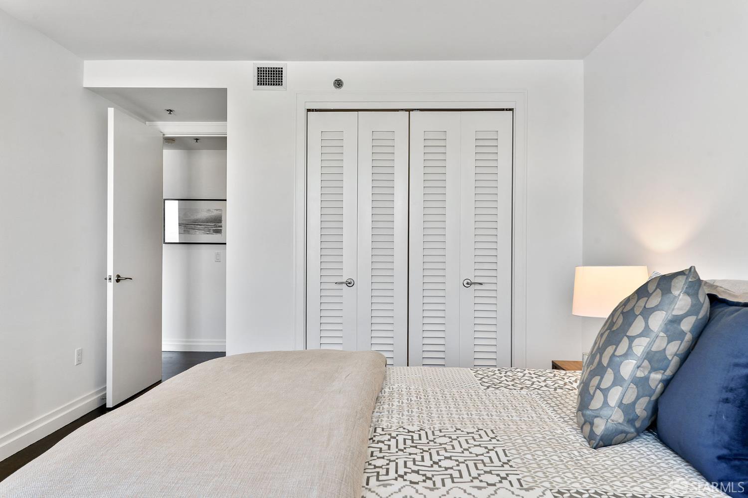 229 Brannan Street, Unit 12C San Francisco, CA 94107 - Photo 33 of 57 a bedroom with a bed and a chair