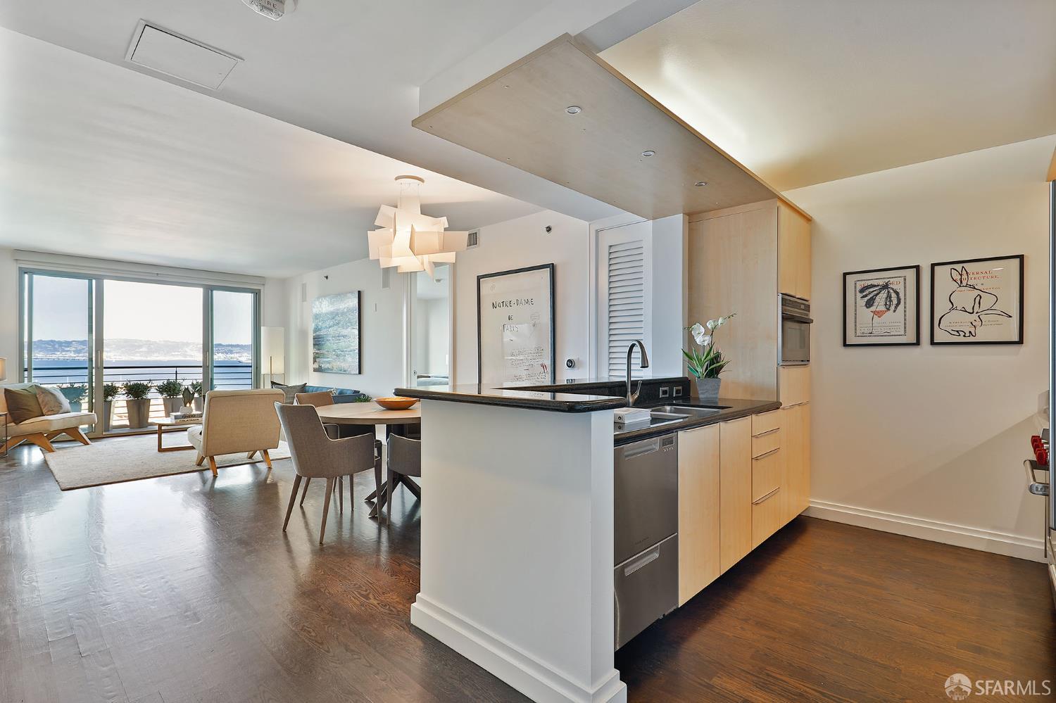 229 Brannan Street, Unit 12C San Francisco, CA 94107 - Photo 4 of 57 a large kitchen with lots of counter space and dining table