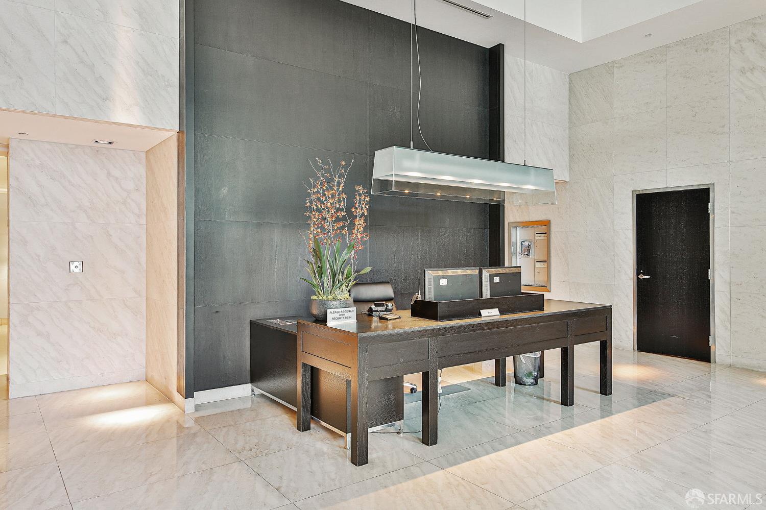 229 Brannan Street, Unit 12C San Francisco, CA 94107 - Photo 54 of 57 a view of a workspace area with painting on the wall