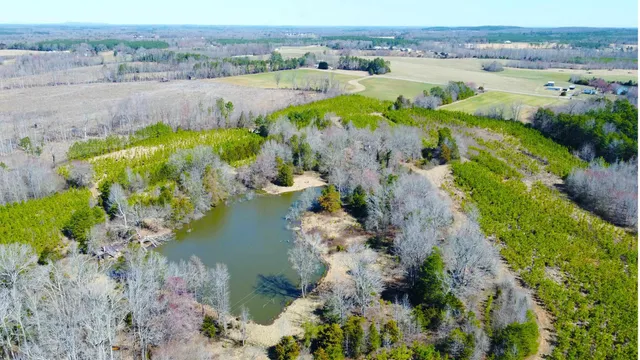 an aerial view of lake with residential houses with outdoor space