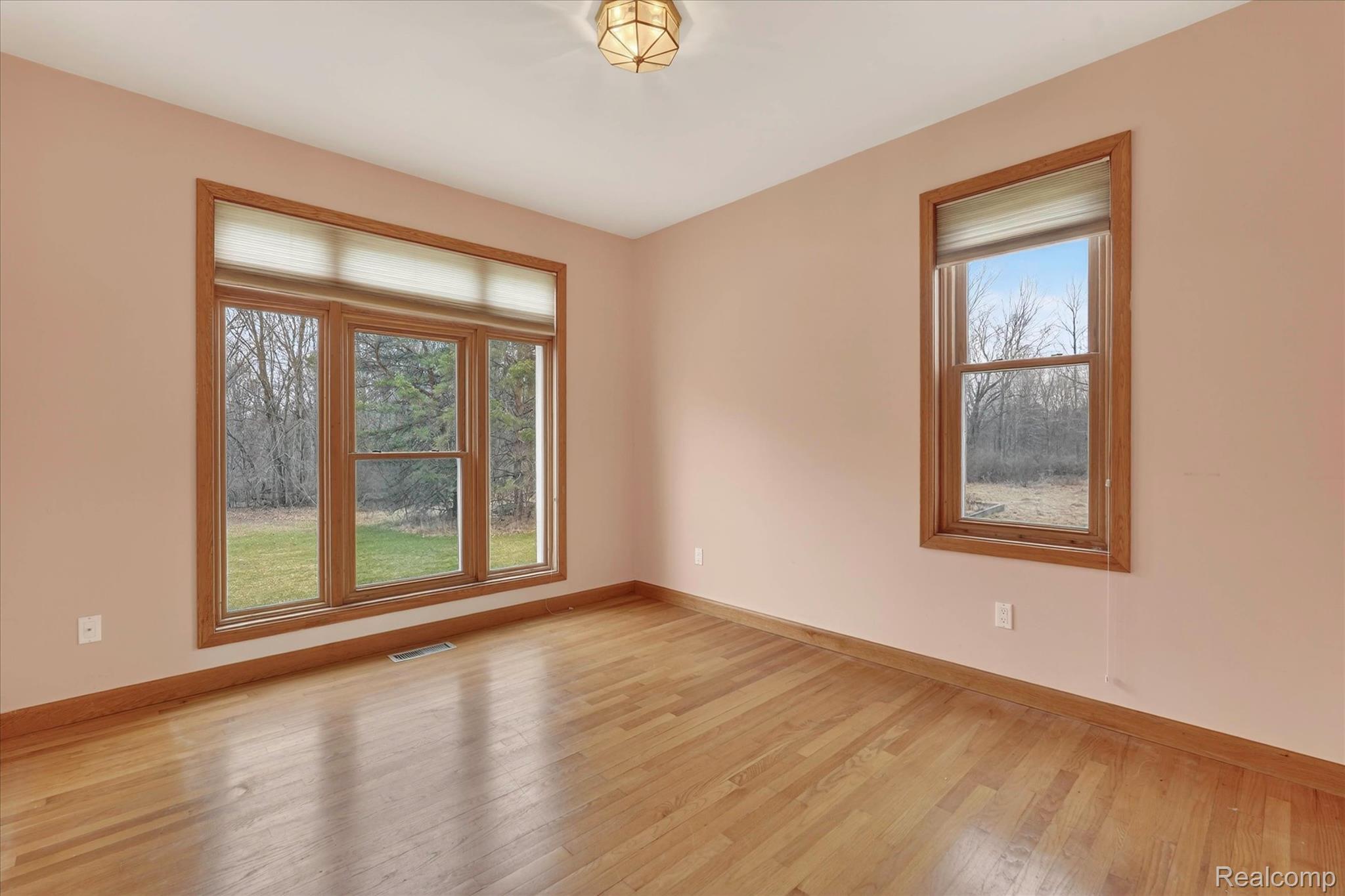 5640 Fisher Road Howell, MI 48855 - Photo 15 of 66 Unfurnished room featuring light wood-style flooring and healthy amount of natural light