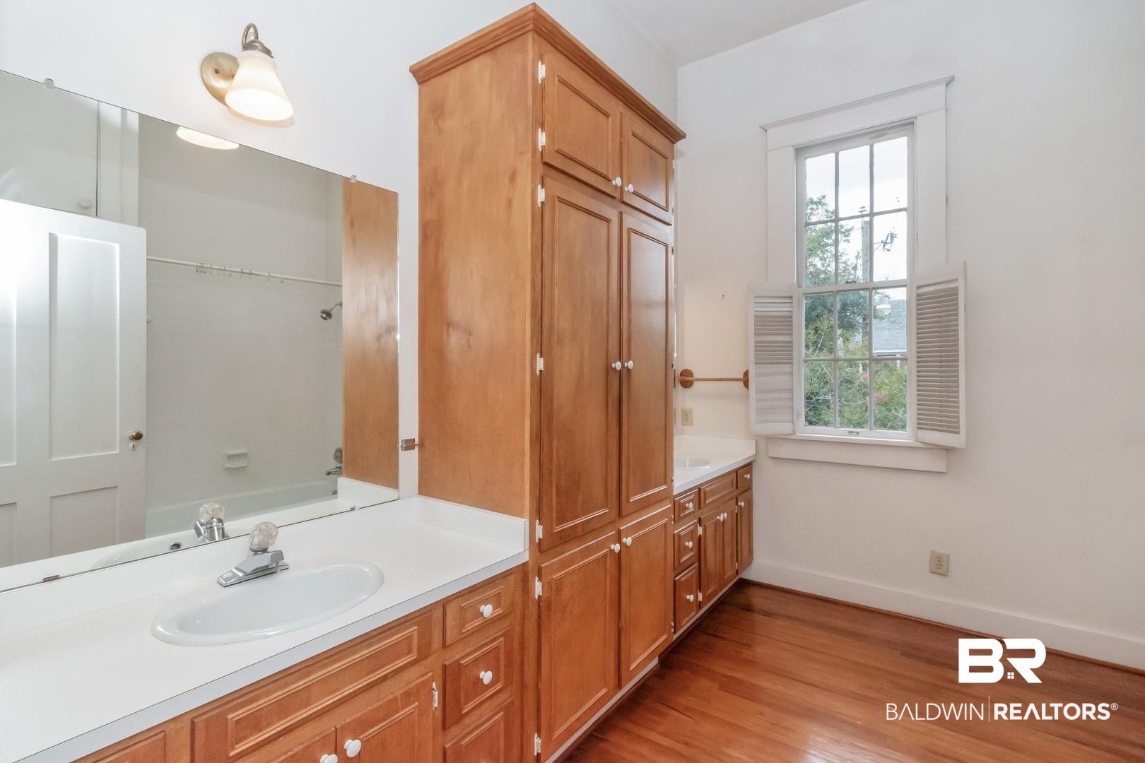 959 Dauphin Street Mobile, AL 36604 - Photo 26 of 43 Bathroom with vanity and wood-type flooring