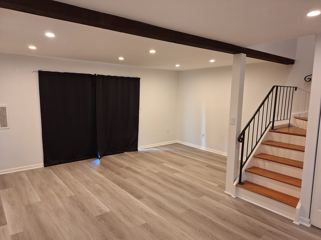 4 Beal's Cove Road, Unit F Hingham, MA 02043 - Photo 12 of 22 a view of a hallway with wooden floor