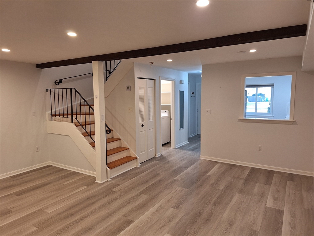 4 Beal's Cove Road, Unit F Hingham, MA 02043 - Photo 13 of 22 a view of an entryway with wooden floor and stairs