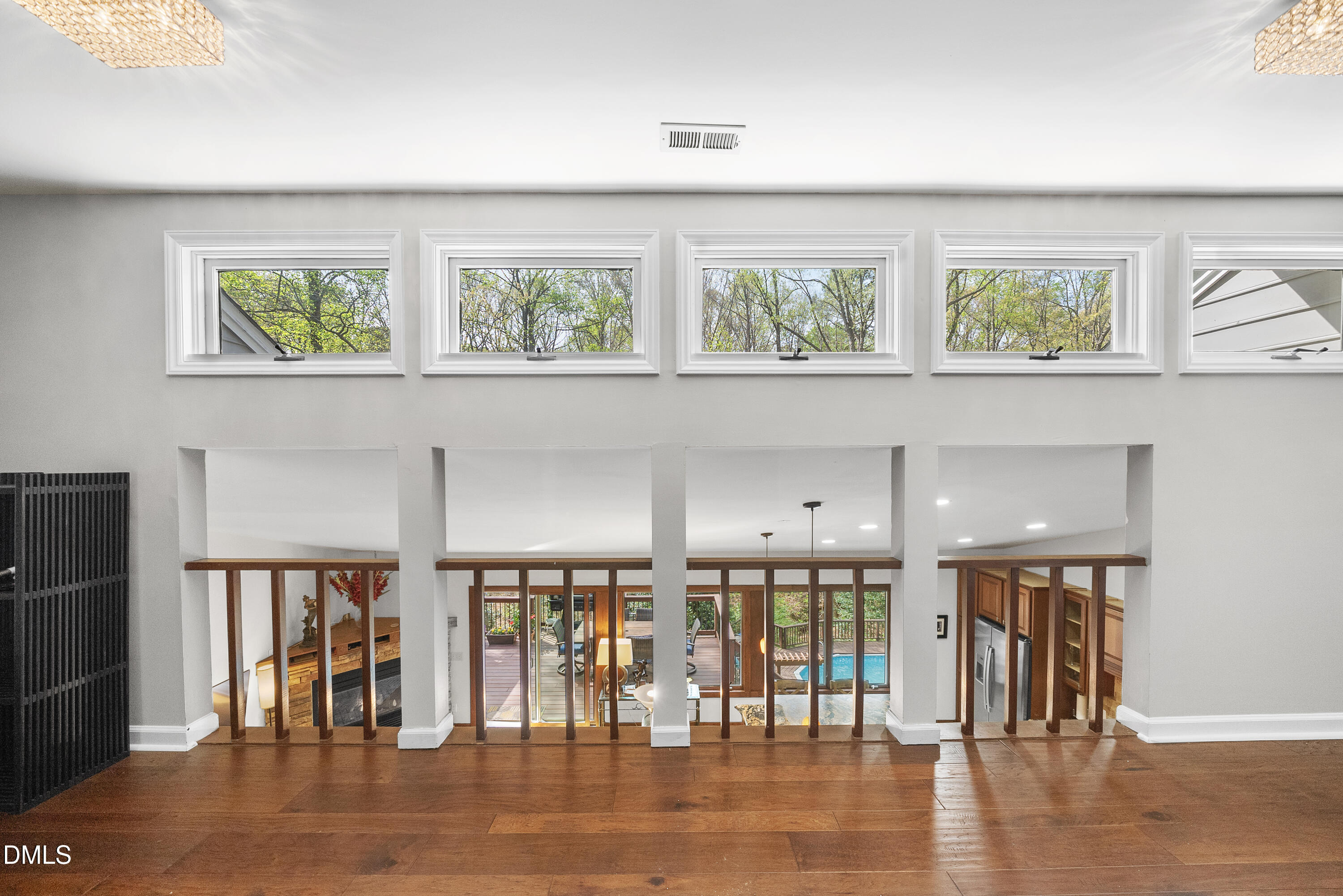 6200 Splitrock Trail Apex, NC 27539 - Photo 59 of 64 a view of an empty room with wooden floor and a window