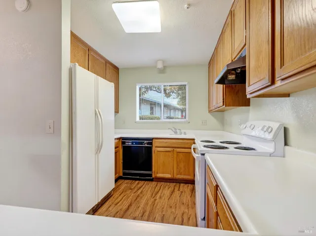a spacious bathroom with a granite countertop sink toilet and shower