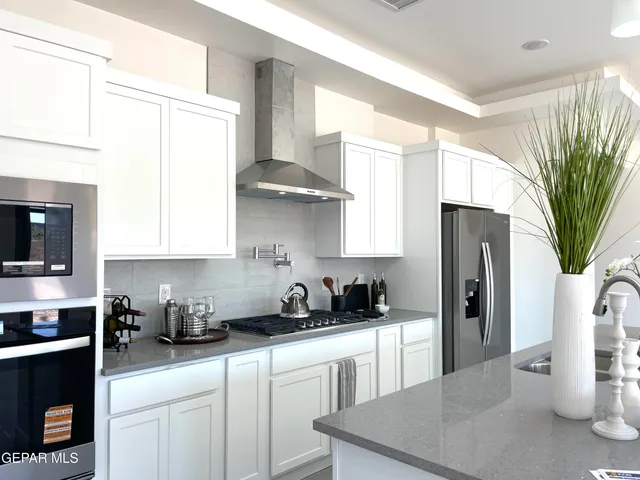 a bedroom with a bed and a white wall