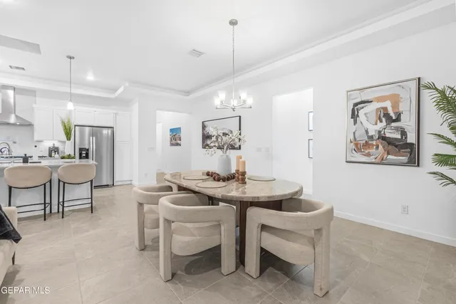 a kitchen with refrigerator and cabinets