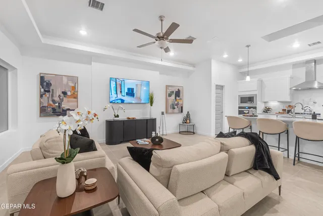 a kitchen with stainless steel appliances granite countertop a refrigerator sink and stove