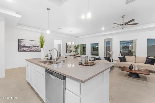 a view of a room with a staircase and a ceiling fan